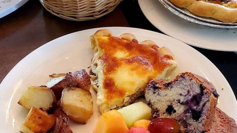 Mother's Day Brunch with quiche, blueberry muffin, assorted fresh fruit and potatoes